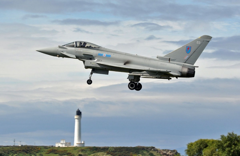 Typhoon flying over Lossiemouth lighthouse