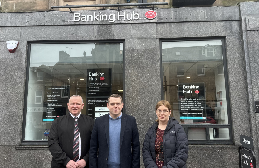 Douglas, Paul and Kathleen stand outside the new Forres Banking Hub