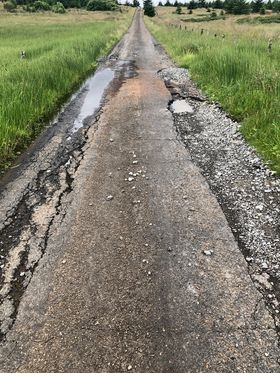 Road with large number of pot holes